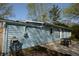 View of the backyard deck with a table and hose at 10360 Wilson Rd, Brownsburg, IN 46112