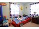 Themed bedroom featuring a car-shaped bed and playful decor at 10360 Wilson Rd, Brownsburg, IN 46112