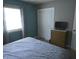 Bright bedroom with a view, showcasing a closet and minimalist decor for a clean aesthetic at 10360 Wilson Rd, Brownsburg, IN 46112