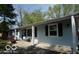 Charming ranch-style home featuring a light blue exterior and well-maintained landscaping at 10360 Wilson Rd, Brownsburg, IN 46112