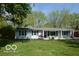 Charming single-story home with well-maintained lawn and mature trees at 10360 Wilson Rd, Brownsburg, IN 46112