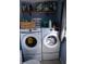 Laundry room with side-by-side washer and dryer and shelving at 10360 Wilson Rd, Brownsburg, IN 46112