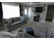 A living room featuring comfortable seating, a TV, and natural light, perfect for relaxation and entertainment at 10360 Wilson Rd, Brownsburg, IN 46112
