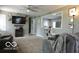 Comfortable living room with a fireplace, large TV, and modern furnishings at 10360 Wilson Rd, Brownsburg, IN 46112