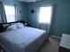 Spacious main bedroom with soft bedding, ample natural light, and calming neutral tones at 10360 Wilson Rd, Brownsburg, IN 46112