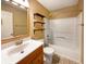 Bathroom with a shower-tub combo, floating shelves and vanity at 10376 Alice Ct, Fishers, IN 46038