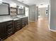 Dual vanities, wood floors, and open passage into the bathroom and bedroom, creating a Primary suite at 10376 Alice Ct, Fishers, IN 46038