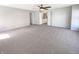 Spacious bedroom with neutral carpet, a ceiling fan, and white trim at 10376 Alice Ct, Fishers, IN 46038