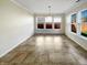 Bright dining room featuring tile floors and three large windows at 10376 Alice Ct, Fishers, IN 46038