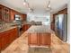 Well-equipped kitchen with stainless steel appliances, granite countertops, and a large kitchen island at 10376 Alice Ct, Fishers, IN 46038