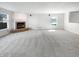 Bright living room featuring a brick fireplace and plush carpet at 10376 Alice Ct, Fishers, IN 46038