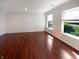 Bright living room features hardwood floors, crown molding, and natural light at 10376 Alice Ct, Fishers, IN 46038