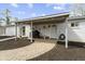 Backyard with a covered patio, grill, and hardscaped walkway to the back door at 10421 Hillsdale Dr, Carmel, IN 46032