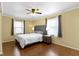 Inviting bedroom with hardwood floors, natural light, neutral tones, and stylish furnishings at 10421 Hillsdale Dr, Carmel, IN 46032