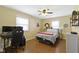 Spacious bedroom with hardwood floors, lots of natural light, and modern desk area at 10421 Hillsdale Dr, Carmel, IN 46032