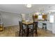 Dining area featuring wood floors, an elegant table set and an open concept design at 10421 Hillsdale Dr, Carmel, IN 46032