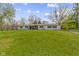 Charming ranch home featuring an expansive lawn, inviting curb appeal, and an American flag at 10421 Hillsdale Dr, Carmel, IN 46032