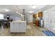 Bright kitchen with large island, modern stainless appliances, wood floors, and stylish pendant lighting at 10421 Hillsdale Dr, Carmel, IN 46032