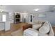 Comfortable living room with stone fireplace, built-in bookshelves, and plush seating arrangement at 10421 Hillsdale Dr, Carmel, IN 46032