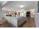 Open concept living room features an eat in kitchen, a fireplace, and hardwood floors at 10421 Hillsdale Dr, Carmel, IN 46032