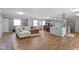 Open concept living space featuring a kitchen, dining area, and living room with hardwood floors at 10421 Hillsdale Dr, Carmel, IN 46032