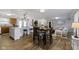 Open concept living space with an eat in kitchen, bar seating, and dining table at 10421 Hillsdale Dr, Carmel, IN 46032