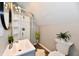 Stylish bathroom featuring a stand-up shower with curved glass doors, and modern fixtures at 106 S Wayburn St, Indianapolis, IN 46229
