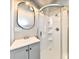 Bathroom with a neo-angle shower, modern sink, mirror and gray color scheme at 106 S Wayburn St, Indianapolis, IN 46229