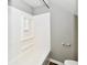 Clean bathroom features a white bathtub with shower and a convenient toiletry caddy at 106 S Wayburn St, Indianapolis, IN 46229