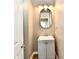 Cozy bathroom showcases a modern vanity with updated fixtures and a stylish mirror at 106 S Wayburn St, Indianapolis, IN 46229