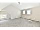 Unfurnished bedroom with carpet, a vaulted ceiling, and natural light from windows at 106 S Wayburn St, Indianapolis, IN 46229