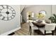 Inviting dining area with a round table, seating, and an open view to the living room and stairs at 106 S Wayburn St, Indianapolis, IN 46229