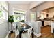 Charming dining area with a view to the kitchen, perfect for Gathering meals at 106 S Wayburn St, Indianapolis, IN 46229