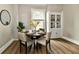 Inviting dining area with a round table, comfortable seating, and ample natural light at 106 S Wayburn St, Indianapolis, IN 46229