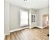 Dining Room with hardwood-look floors, neutral paint and built-in display cabinet at 106 S Wayburn St, Indianapolis, IN 46229
