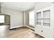 Dining Room with hardwood-look floors, neutral paint and built-in display cabinet at 106 S Wayburn St, Indianapolis, IN 46229