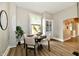 Dining area featuring a round table with seating for four and a built-in cabinet at 106 S Wayburn St, Indianapolis, IN 46229