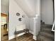 Hallway with bench seating, stylish mirrors, and access to a staircase and back door at 106 S Wayburn St, Indianapolis, IN 46229