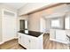 Beautiful kitchen with white cabinetry, island, and hardwood floors at 106 S Wayburn St, Indianapolis, IN 46229