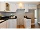 Well-appointed kitchen showcasing white cabinetry, modern appliances, and bright natural light at 106 S Wayburn St, Indianapolis, IN 46229