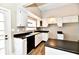 Bright kitchen features white cabinets and modern appliances at 106 S Wayburn St, Indianapolis, IN 46229