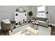 Bright living room featuring a decorative fireplace, plush seating, and stylish furnishings at 106 S Wayburn St, Indianapolis, IN 46229
