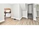 Bright living room featuring hardwood floors, and an open archway to the kitchen at 106 S Wayburn St, Indianapolis, IN 46229