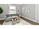 Comfortable living room featuring a stylish sofa, modern lighting, and neutral color palette at 106 S Wayburn St, Indianapolis, IN 46229
