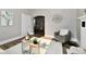 Cozy living room with stylish seating, decorative accents, and an open archway at 106 S Wayburn St, Indianapolis, IN 46229