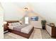 Bedroom with a large bed, mounted television and tasteful design at 106 S Wayburn St, Indianapolis, IN 46229