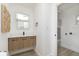 Stylish bathroom featuring a contemporary floating vanity with an adjacent laundry room at 109 S 10Th S Ave, Beech Grove, IN 46107