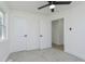 Light bedroom with paneled doors, gray carpeting, and fresh, clean white paint and trim at 109 S 10Th S Ave, Beech Grove, IN 46107