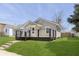 Gray home featuring a cozy porch, clean lines, and a well-maintained lawn at 109 S 10Th S Ave, Beech Grove, IN 46107