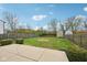 Fenced backyard features a lush green lawn, patio, and a storage shed at 10905 Amber Glow Ln, Indianapolis, IN 46229